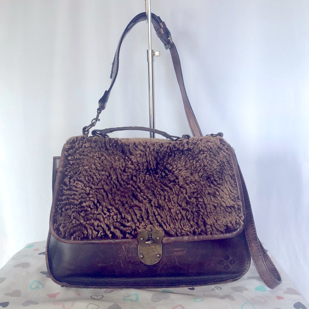 PATRICIA NASH dark brown leather saddle bag fur purse with brown fur pom poms.